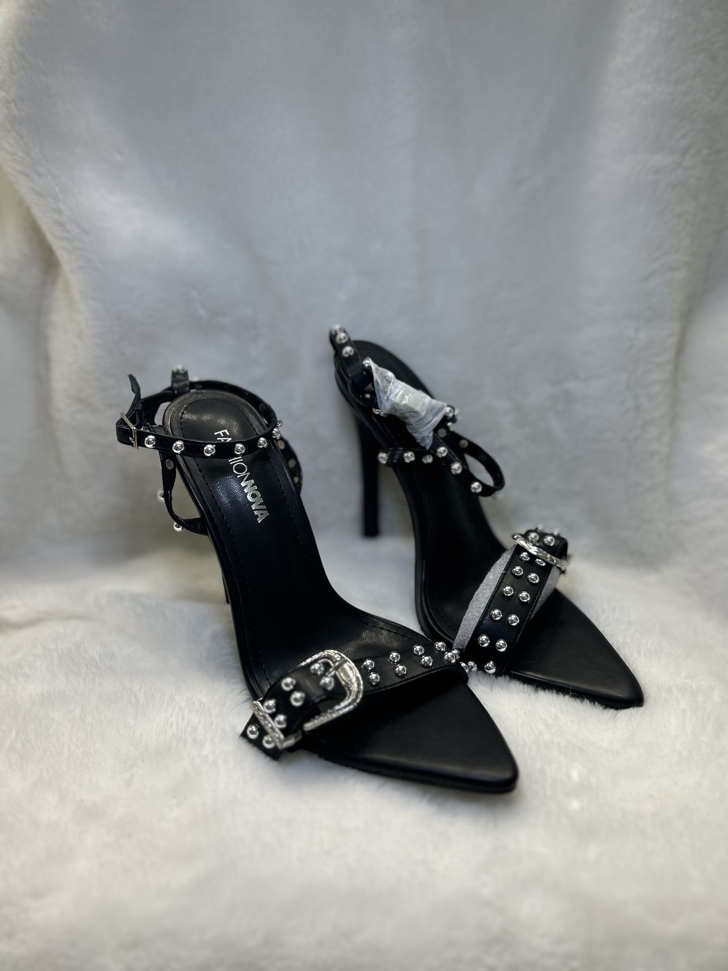 pair of black studded high-heeled sandals from Fashion Nova