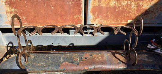 Horseshoe boot rack