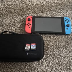 Nintendo Switch With Cover And Two Games That Are Zelda And Mario 3-D World
