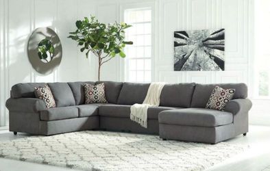Grey sectional couch with ottoman