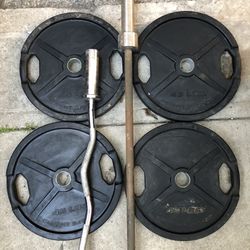 Olympic Weights Have two pairs of rubber coated 45s and an Olympic bar