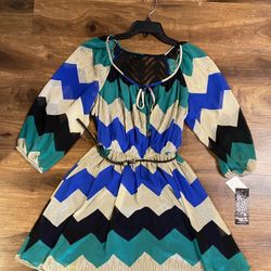 Brand new woman’s Sequin Hearts brand blue, teal, black, and white colored zig zag dress up for sale 