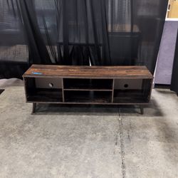 Distressed Dark Wood Multi-Shelf TV Stand with Tapered Legs