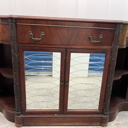 Antique Hutch Cabinet With Hand Carved Wooden Details, Mirrored Doors, And Brass Handles 