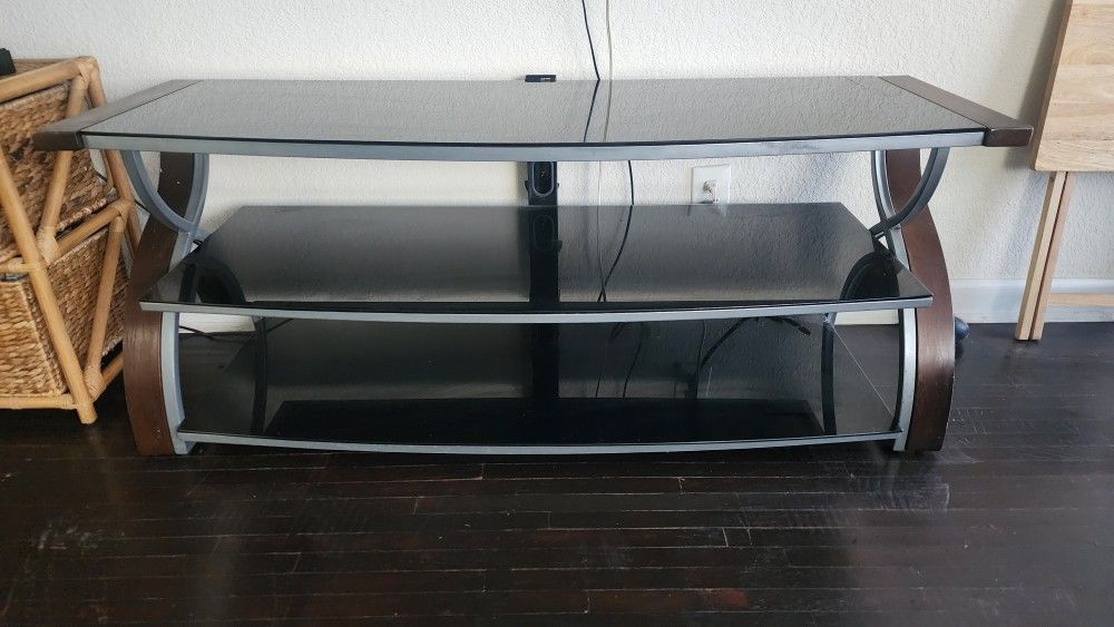 Table Or TV Stand With Tinted Glass Shelves And A Metal N Wood Design , 3 Storage Shelves