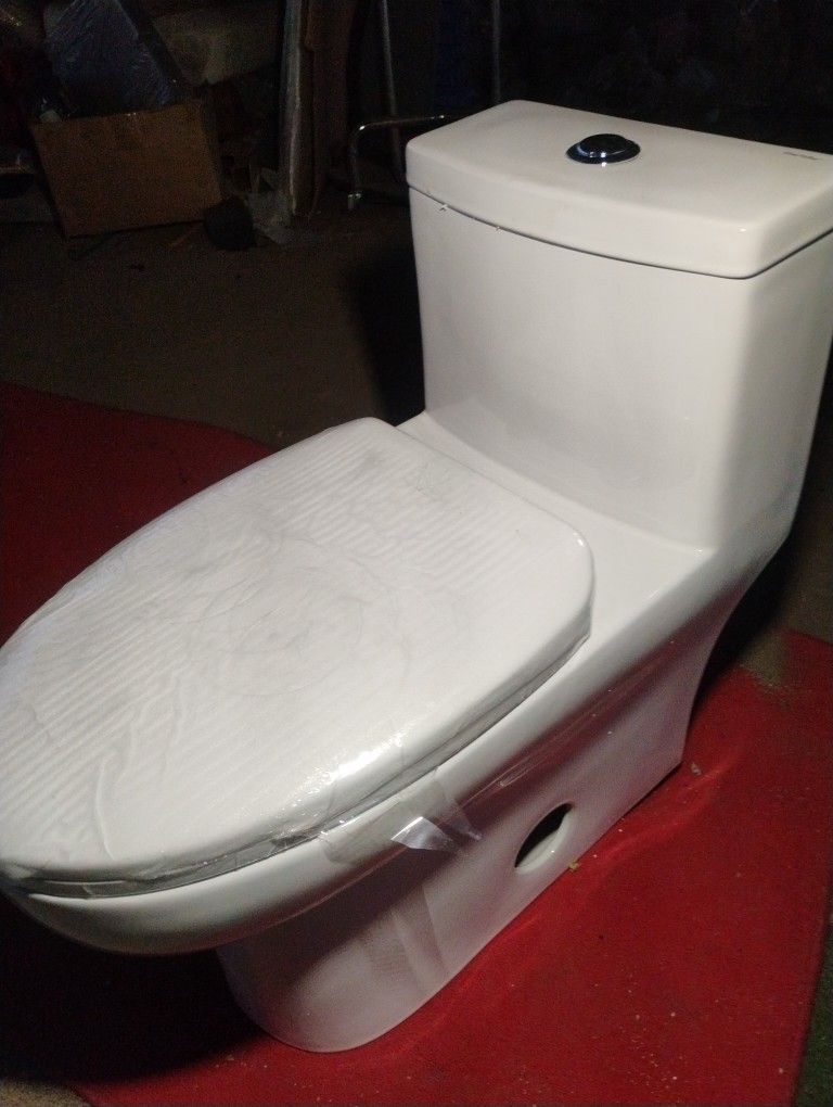 1-piece 0.8 GPF/1.28 GPF High Efficiency Dual Flush Elongated Toilet in. White Soft-Close Seat Included ADA Height