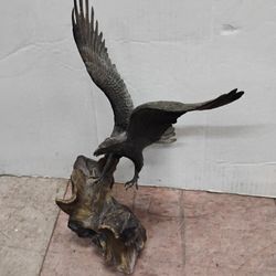 Bronze sculpture of an eagle in flight, titled "Wings of Glory" by British artist Ronald Van Ruyckevelt .
