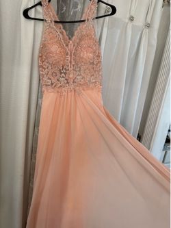 Like new used one time Faviana prom dress color peach size 2
