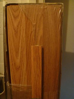 New UnOpened Box of Wood Flooring, Sound Proofing & T-Mold Connecter