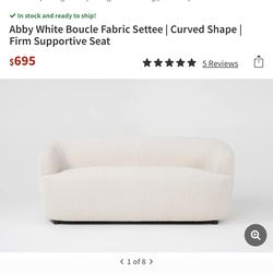 White curved shaped couch