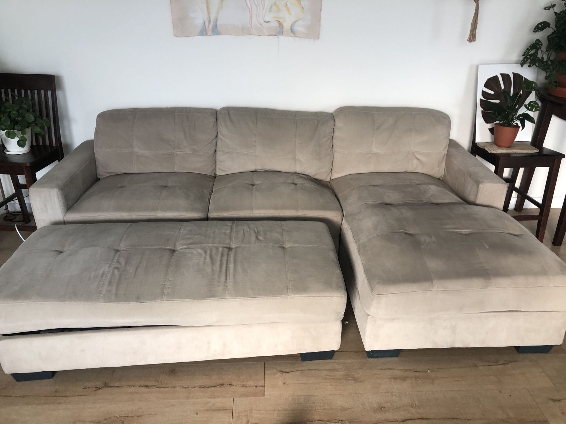 Grey sectional couch with storage ottoman