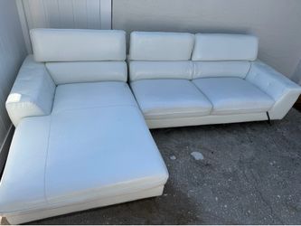 Two-piece white sofa, in good condition.
