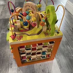 B. toys Zany Zoo Wooden Activity Cube.