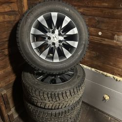 Sumitomo Ice Edge studded winter tires with rims.