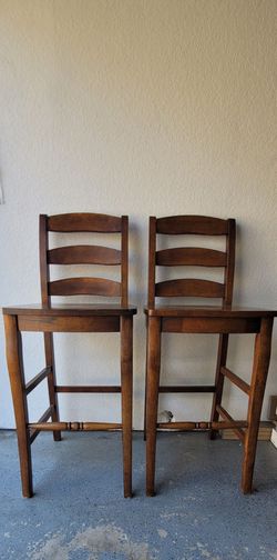 Two hardwood bar stools