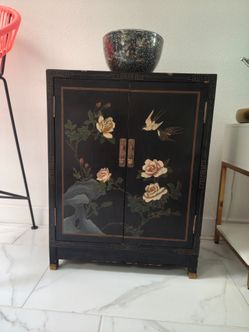 Black Lacquer Asian Cabinet with Floral Art
