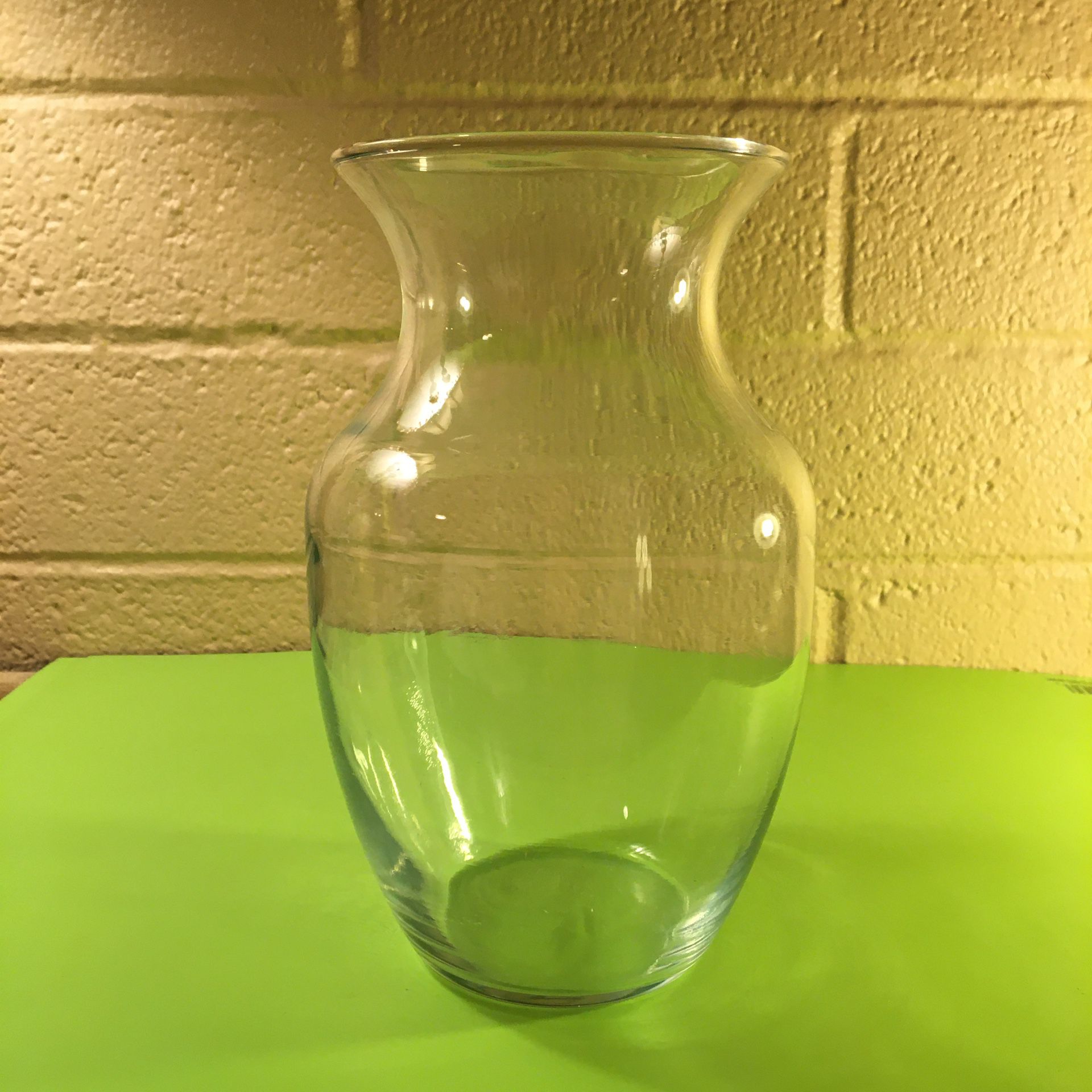 Clear glass vase - 8” tall, 4” diameter at the top