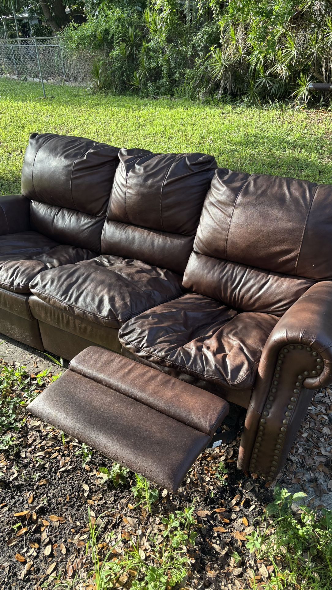 Dark Brown Leather Reclining Sofas - 1 Large and 1 loveseat