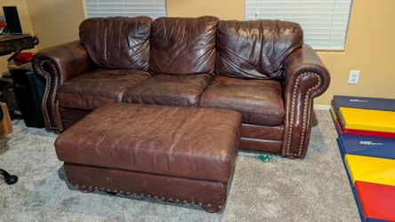 Leather couch,  loveseat and ottoman