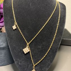 Double gold tone chain necklace with 3 rhinestone squares