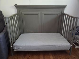 Nursery convertible crib and dresser