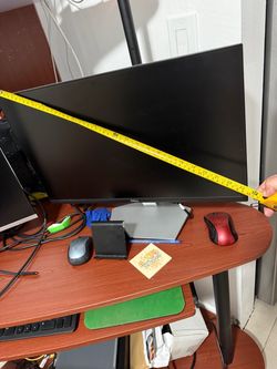 Two 24 inches color computer monitors. One Dell, one HP