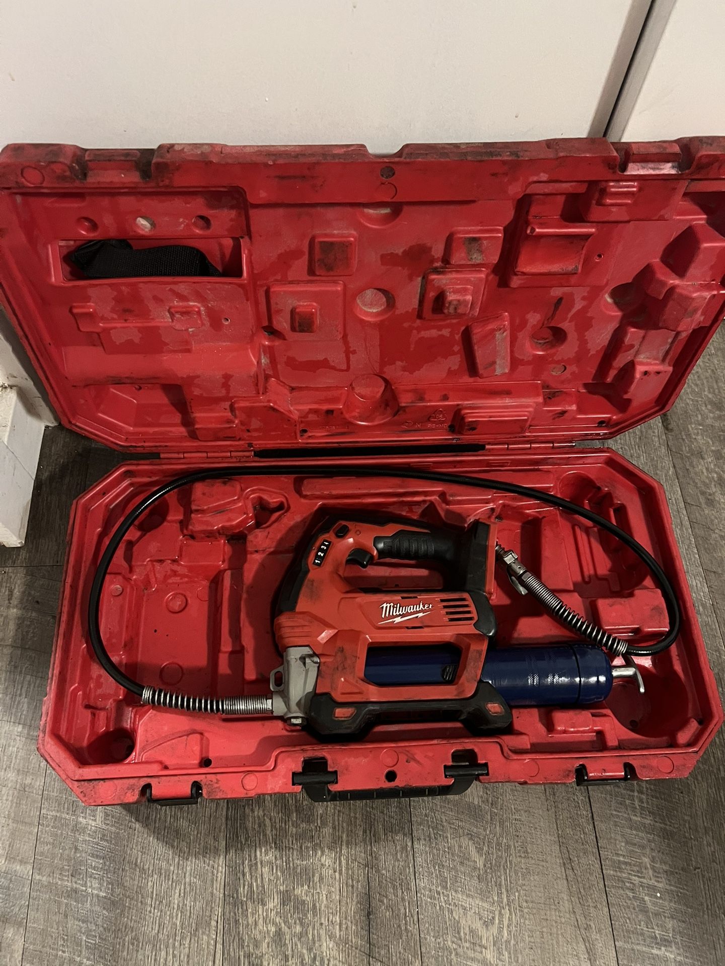 Milwaukee M18 Cordless Grease Gun with hard case.