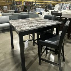 MAYSVILLE BLACK COUNTER HEIGHT DINING TABLE AND BAR STOOLS (SET OF 5)