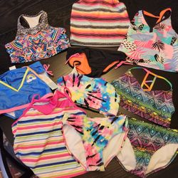 5 Swim Suits And 2 Extra Tops