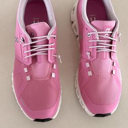 On pink tennis shoes