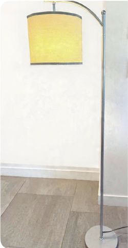 Contemporary floor lamp with brushed nickel finish and cream fabric drum shade.