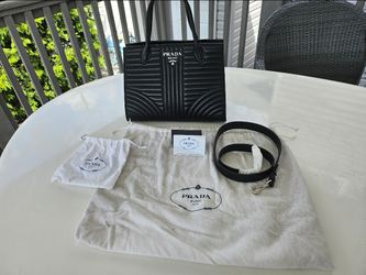 This is an Authentic Prada Soft Calfskin Impunture Diagramme Tote Black bag.