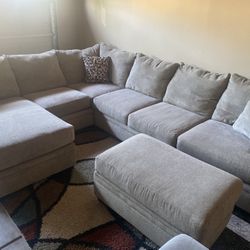 Nice Tan Three Piece Sectional With Ottoman 