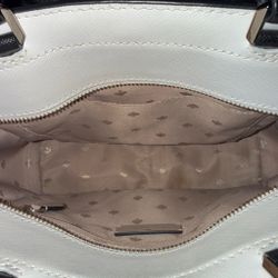Kate Spade Staci medium satchel in a warm beige multi colorblock leather with black trim.