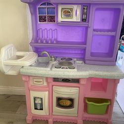 Toy kitchen with baby high chair