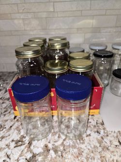 28 Glass Jars of Various Sizes