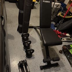Kettle bells, weight bench, weights, & mats