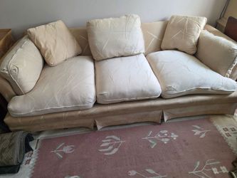 Antique desk hitch and high end couch.