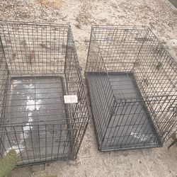 Two large pet carrier/cages