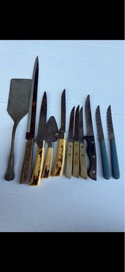 Assorted kitchen knives and serving utensils