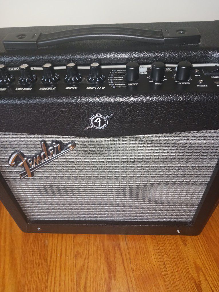 FENDER AMP, CORD AND GUITAR CABLE.