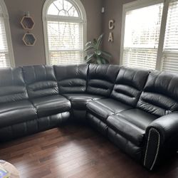 Ashley's Black Faux Leather Sectional Couch