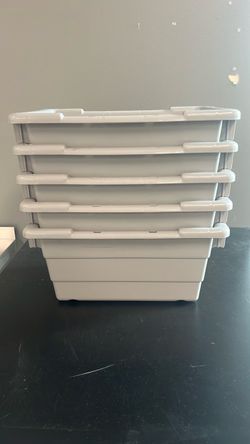 5 plastic storage bins