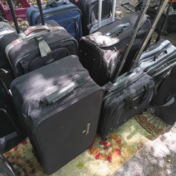 LOTS OF NICE PULL ALONG LUGGAGE 