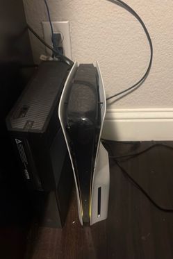 PlayStation 5 and two controllers