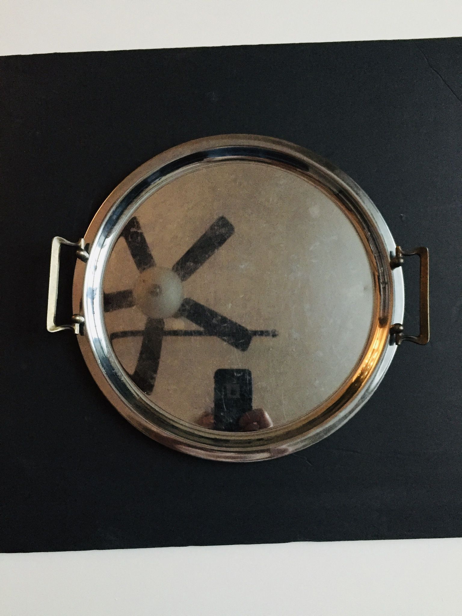 Vintage Antique. Round metal tray with 2 Yellow Metal handles. Like new condition. Diameter: 12.75”. Great bargain.