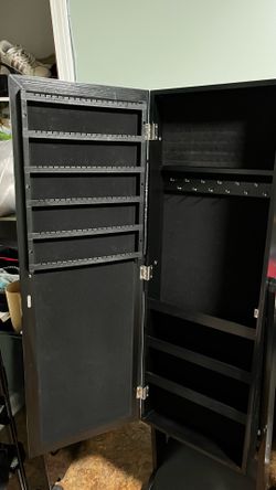 Mirror with jewelry storage