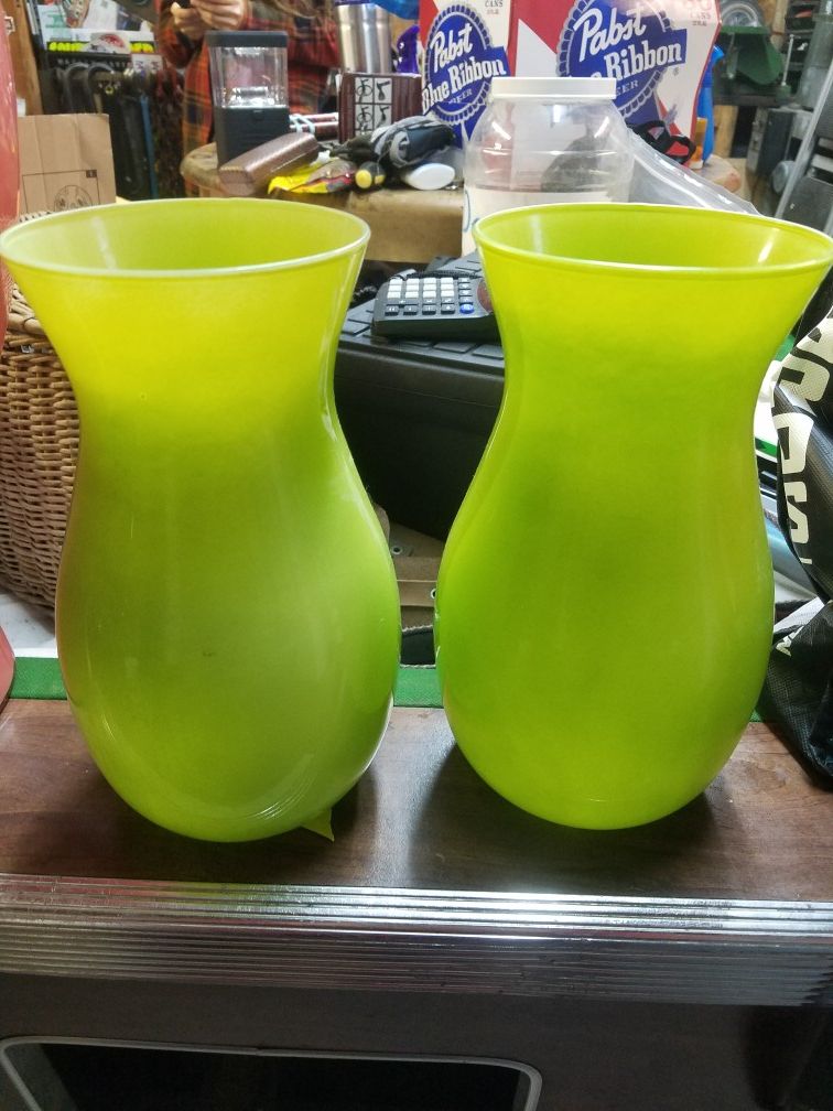 Pair of green glass vases.