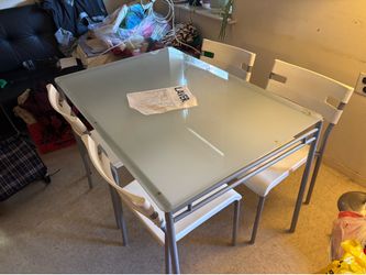 Glass top dining set with 4 chairs
