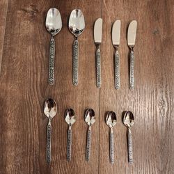 10 stainless steel flatware, floral scroll pattern, great condotion